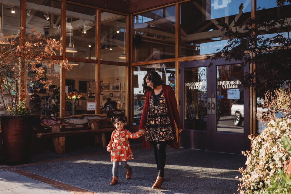 woman holding childs hand