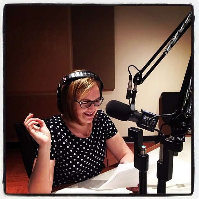 Zoe Clark at a microphone