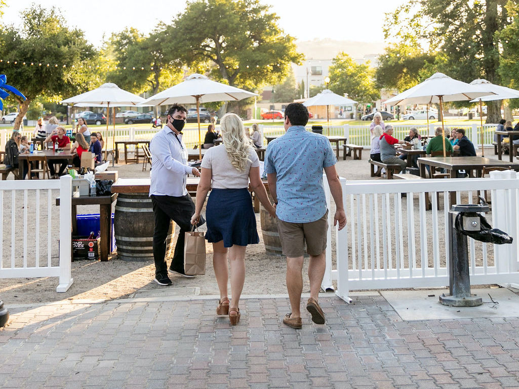 couple walking into park dining area