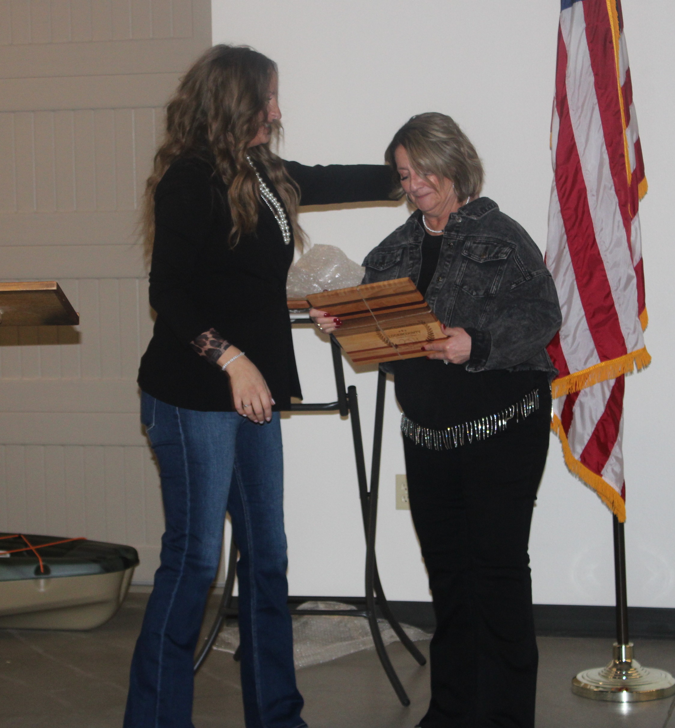 Caitlin Baseggio, executive director of the Logan County Chamber of Commerce, presents the Chamber Supporter of the Yeard Award to Kathy Guerin during the Chamber's "Hometown Proud: Return to Rural" Banquet and Awards Friday, Jan. 24, 2025. (Callie Jones/Journal-Advocate)