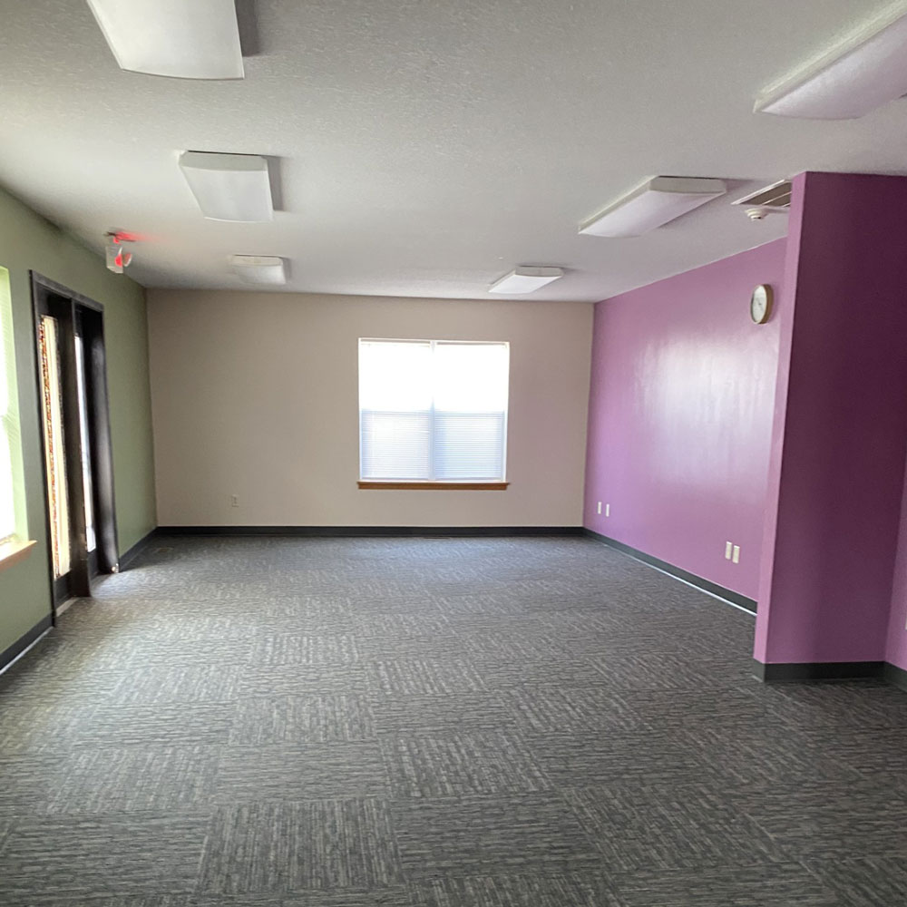 colorful office space with large window.