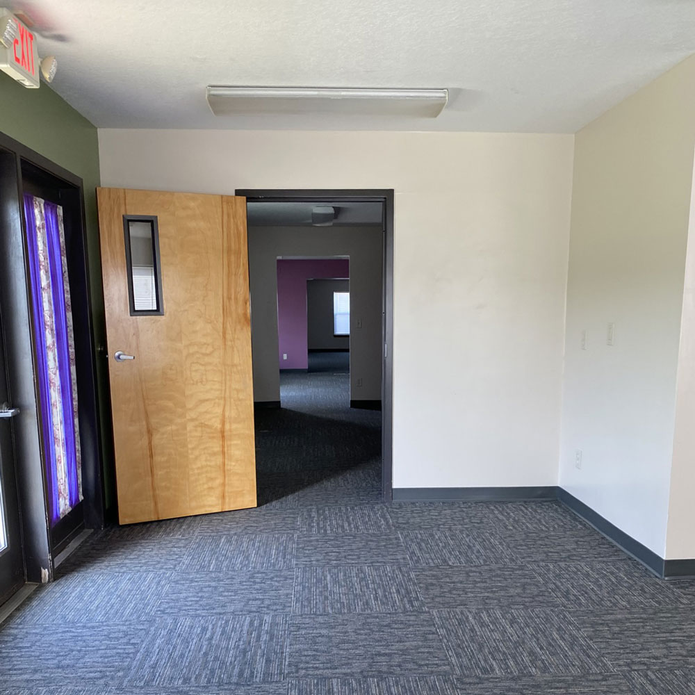 Open door into office space.