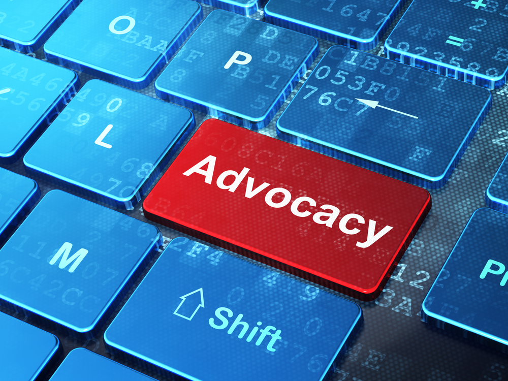 Law concept: Advocacy on computer keyboard background