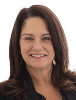 Dr. Lucy Leclerc headshot, woman with long brown hair, black blouse, jewelry