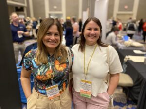 Two attendees networking at the 2024 Welcome Reception.