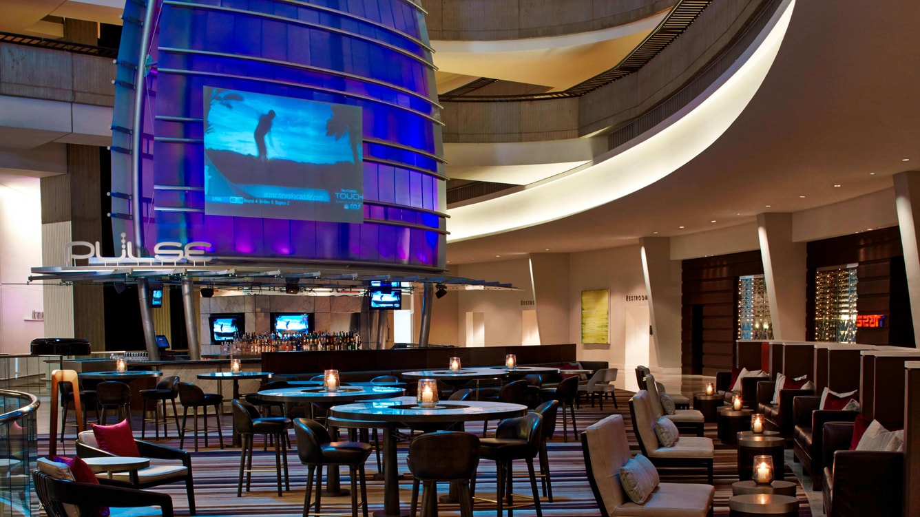 atlmq-bar-0222-hor-wide Pulse is the innovative Lobby Lounge. By day, it's an unassuming restaurant for eating and relaxing. By night, it transforms into a hotspot, an Atlanta bar offering creative cocktails.