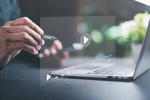 young man using laptop to watch video,Training, learning, teaching, virtual reality used in online video conferencing,Online streaming Watch videos on the Internet