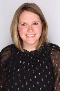 Samantha Scripture headshot, female with blonde and light brown, shoulder-length hair, black blouse with embellishments