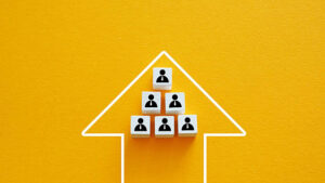 Team figures with a leader and an upward arrow. Leadership growth. Team figures with a leader and an upward arrow. Leadership growth.