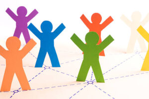 SDOH Colorful paper people networking together. Focus on the orange and green people. Similar: