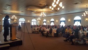 speaker talking to room of people