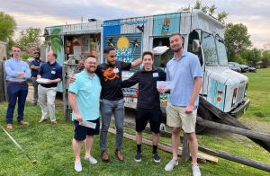 people outside in front of food truck