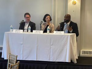 3 speakers at a table