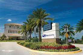 front of building with palm trees