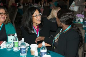 women talking at womens conference