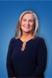 Melanie Blue Headshot 2026