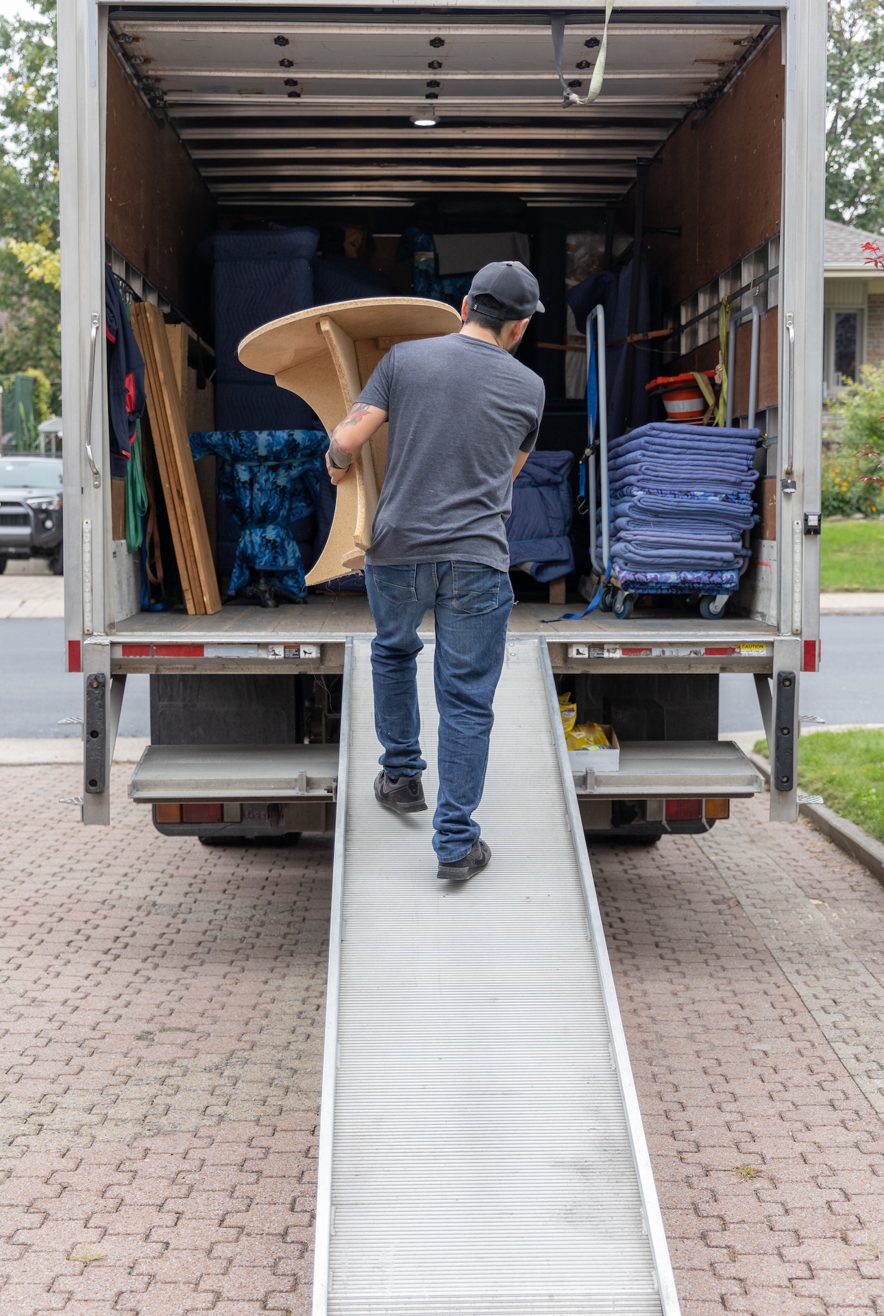 Professional mover carrying furniture