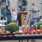 Laci Hays, Debbie Stewart, Kat Barker sing the National Anthem