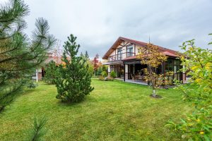 A house with a patio and a big yard