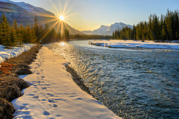 Winter sunrise on the Bow River at Canmore, Alberta, Canada