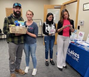 NLCC BAH A 10.21.25 WAVE Member, Paulina Vega Flores, Assists with BAH Door Prize Drawing 10.21.25