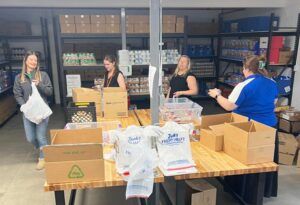 WAVE members volunteering at the April 2026 Filling Backpacks Program