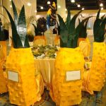 pineapple decorated table at chairman's ball