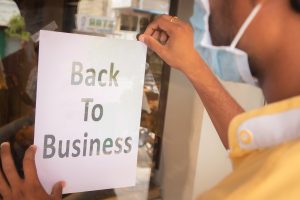 Man With Medical Mask Businesses Remain Open