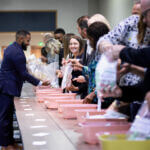 Instructor and attendees engaged in activity