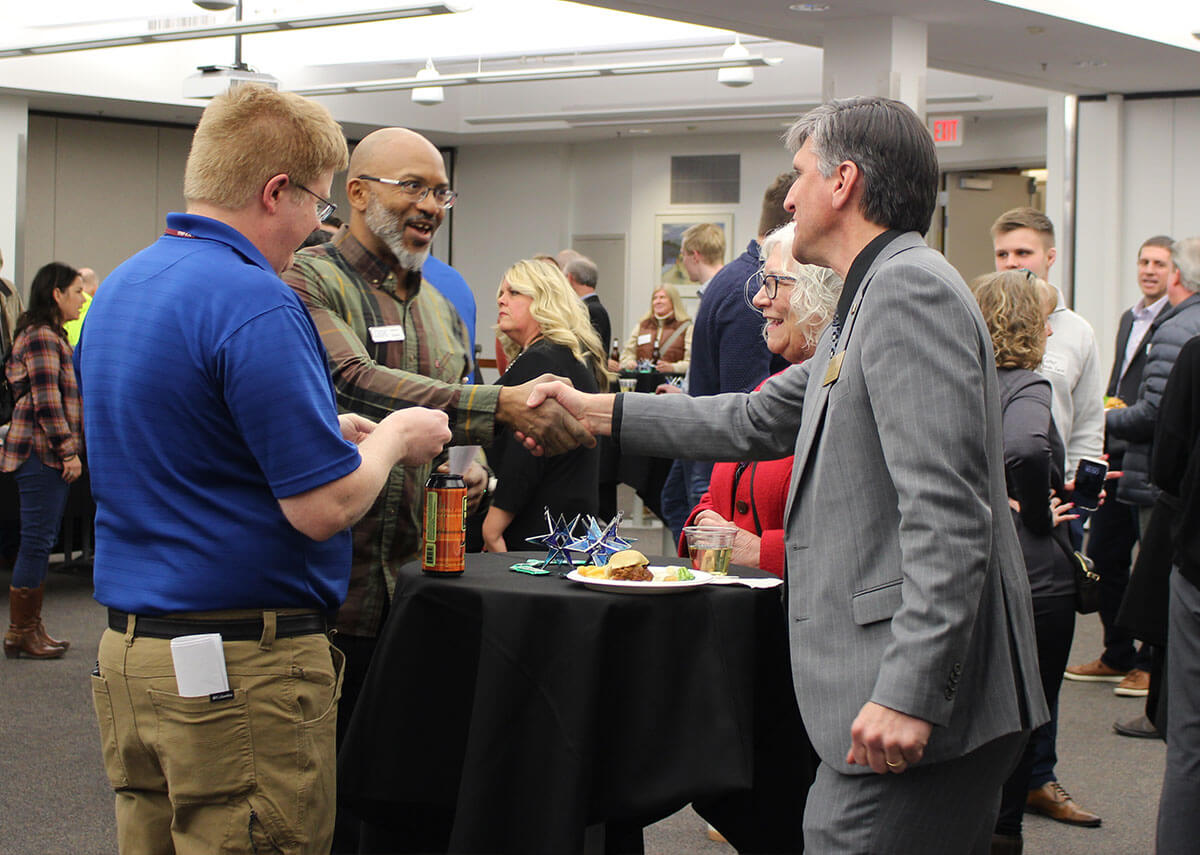 People networking and shaking hands