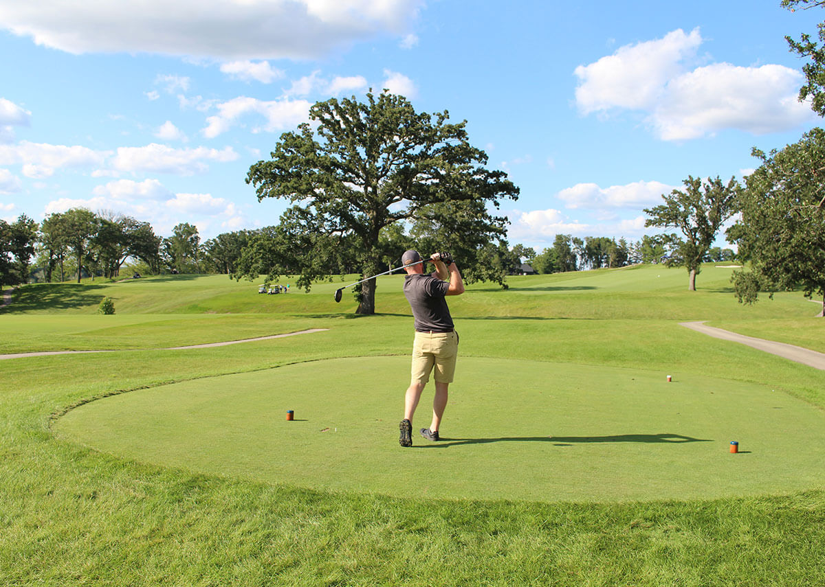 Golfer Swinging Club