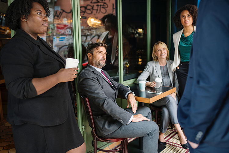 People in Coffee Shop Meeting
