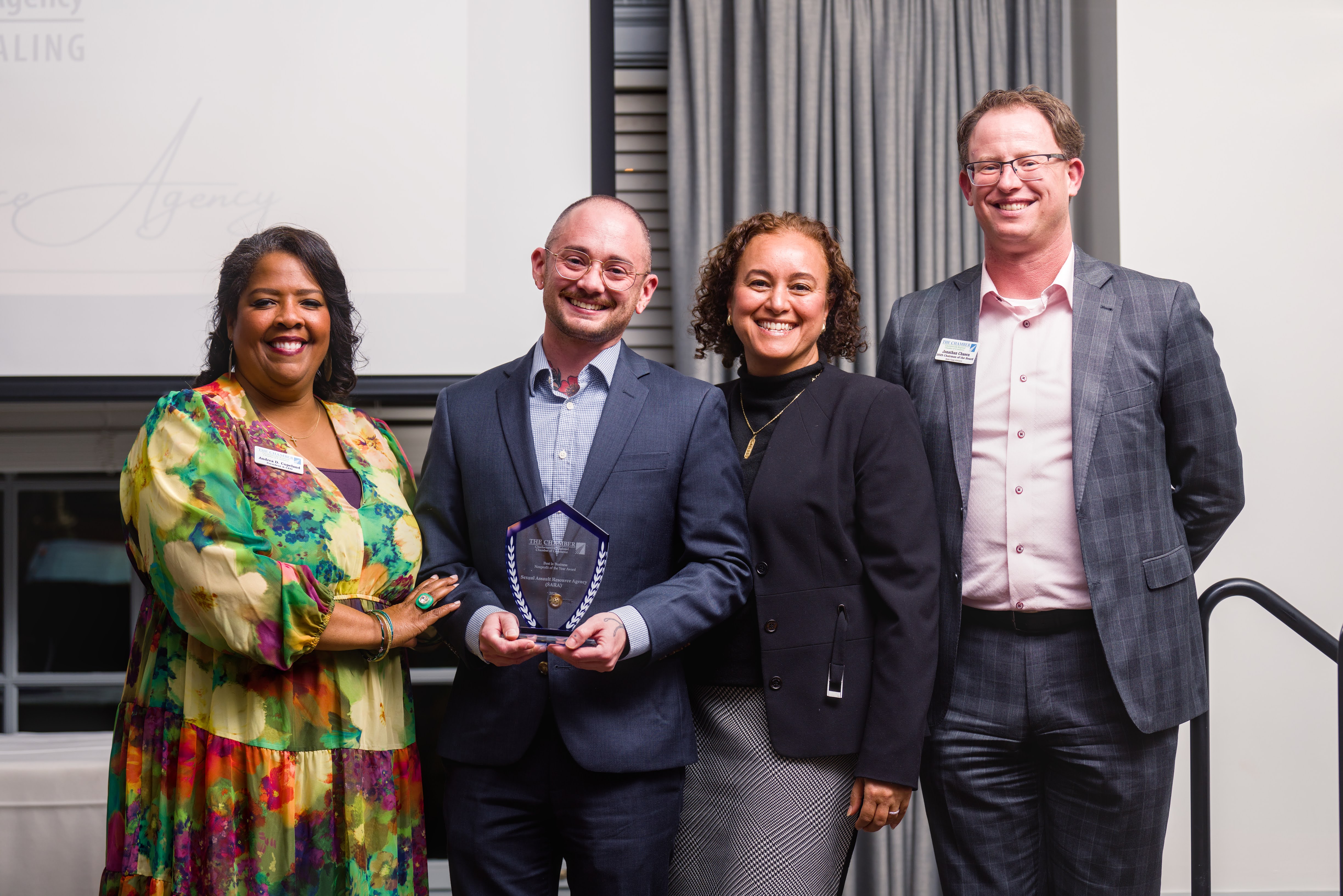 Bass Wolf, Executive Director at SARA, accepting the Nonprofit of the Year Award.