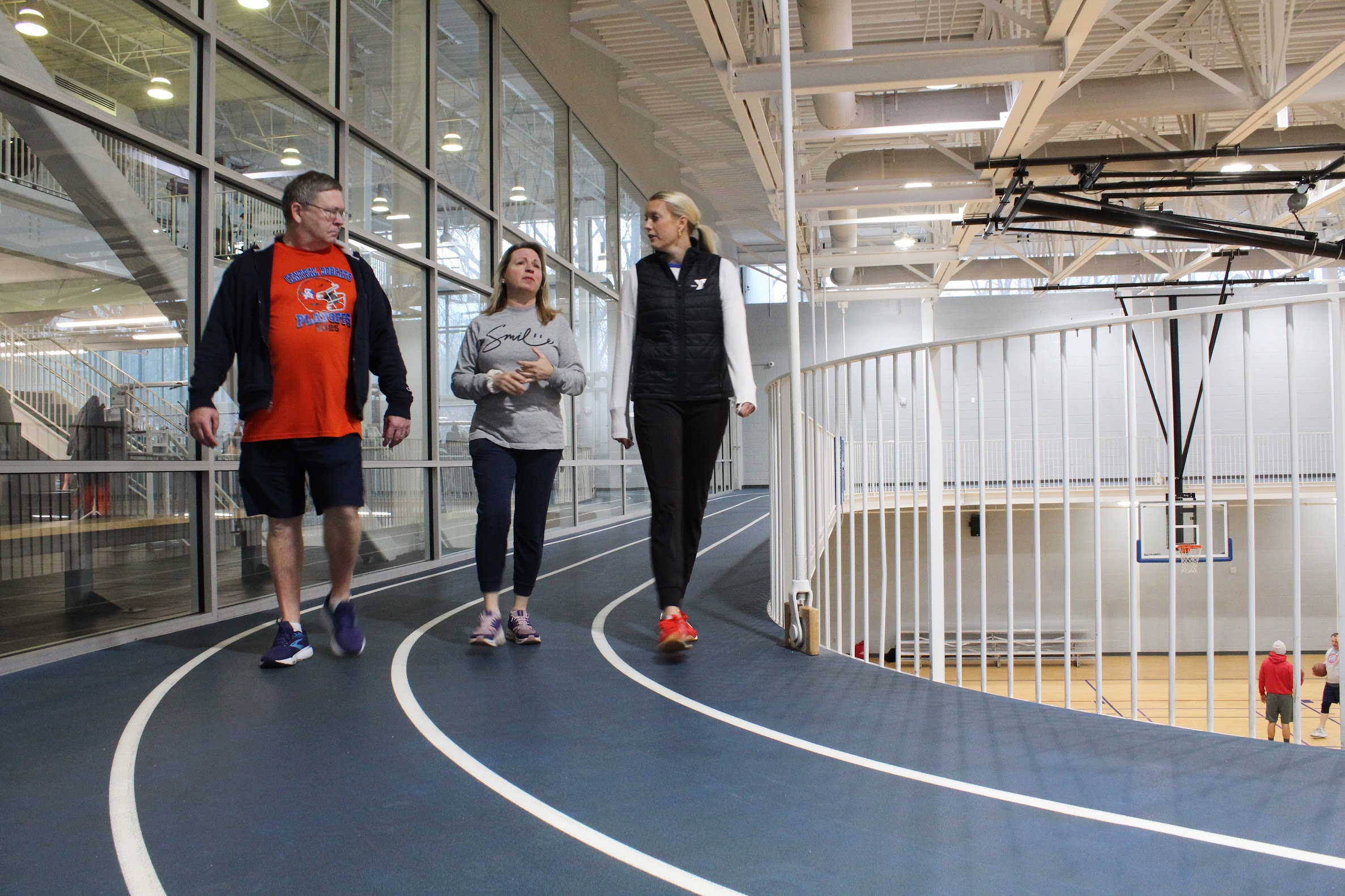 Guest walker, Jessica Taylor, networking with event attendees.