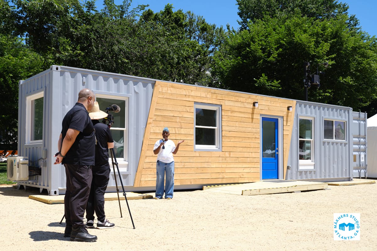 Wanona Satcher is interviewed outside her Makhers Studio container building factory