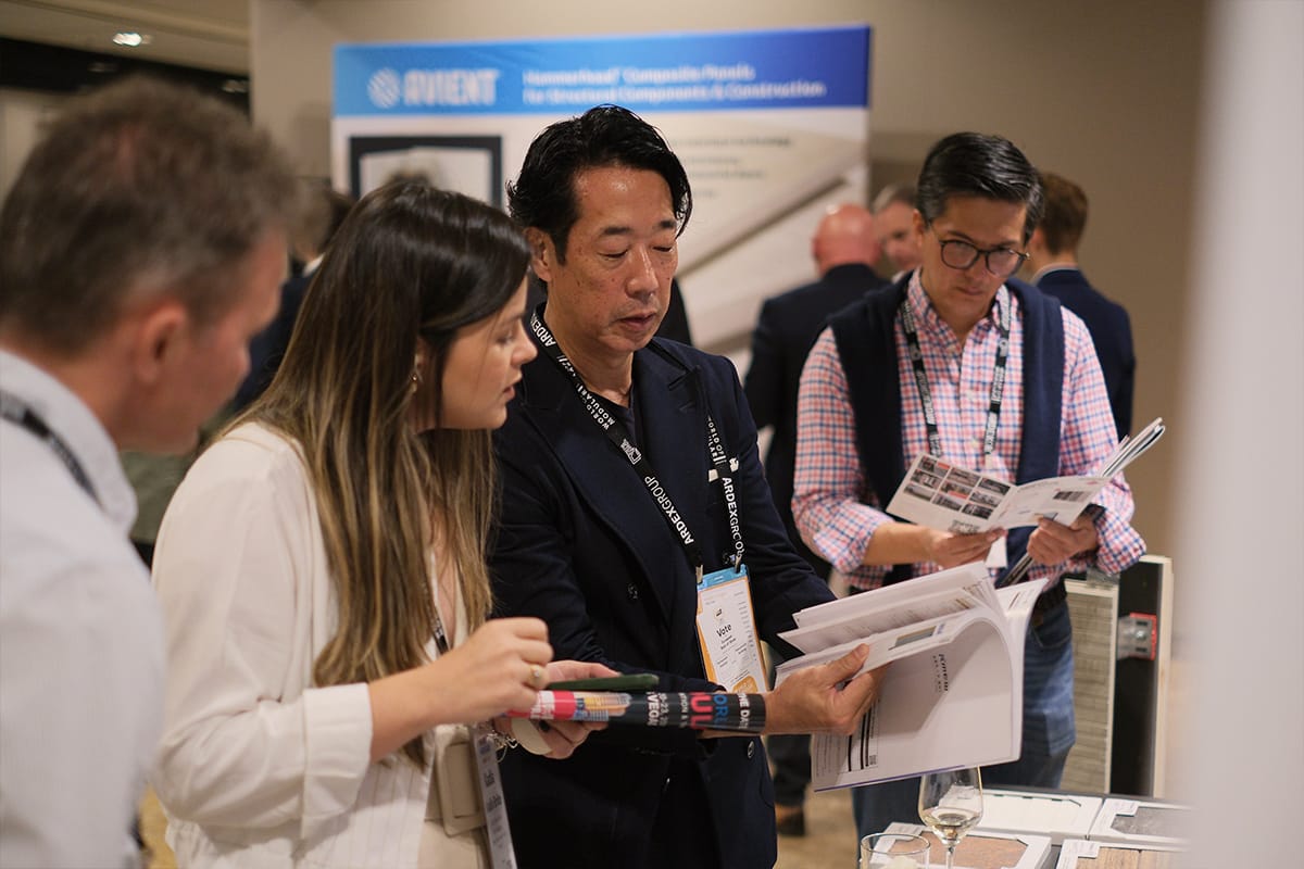 exhibitors speak with attendees at World of Modular Europe