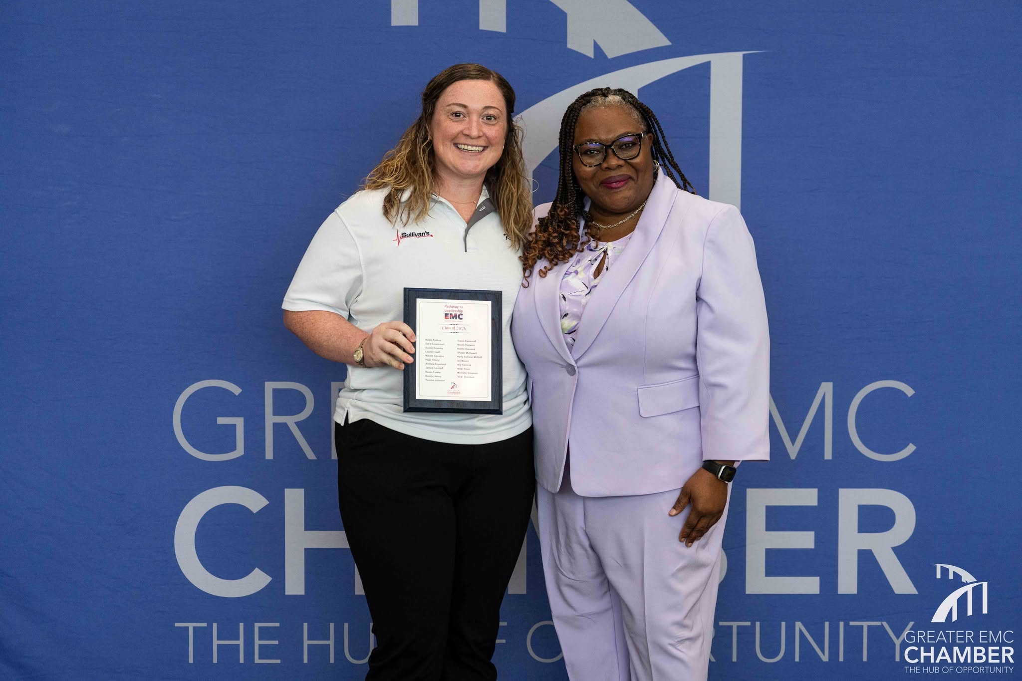 Kelly stands with Dr. Kimberly DiStefano, leadership facilitator for Pathway to Leadership EMC, to be recognized for her program completion.
