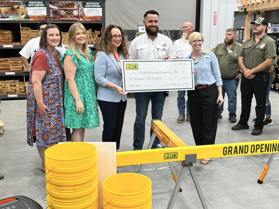 McCoy's Building Supply - New Caney presents a check to the Splendora ISD Education Foundation at their grand opening