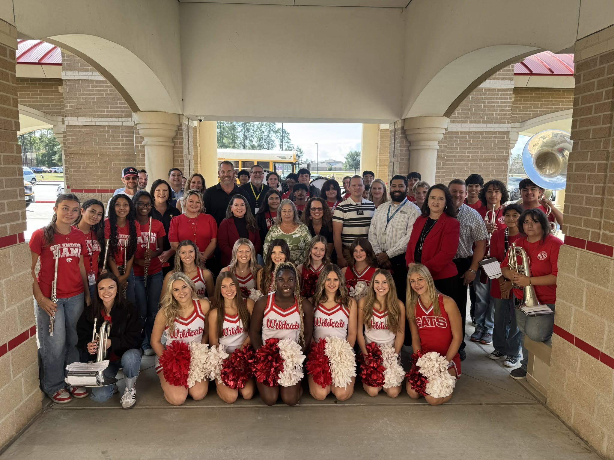 A group of students, teachers, staff and community leaders with the Grant Prize Patrol show their appreciation to teachers
