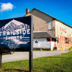 3/4 Exterior of Trailside Events building and sign
