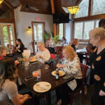 Ladies eating lunch at dining table inside Nick's Lakehouse Restaurant