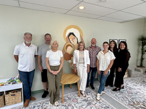 Sales & Marketing Council board members and volunteers wrap up the transformation to the Mother's Room at Samaritan House.