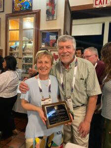 Maria Rose Petrizzo with the James B. Thompson Jr. Distinguished International Lecturer Award, with Mark Leckie.