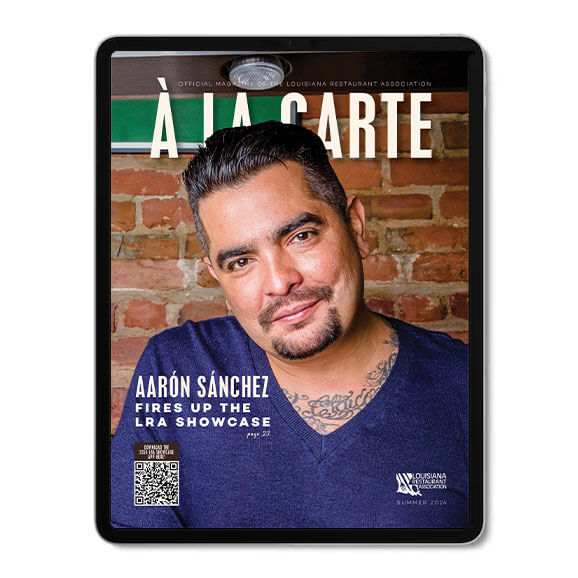 Ipad Image of A La Carte magazine The magazine has Aaron Sanchez wearing a blue shirt on the cover.