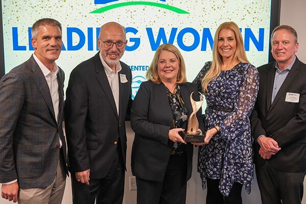 Beth Hollis of West Herr Auto Group is presented the 2025 ATHENA Leadership Award by the Buffalo Niagara Partnership.