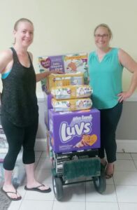 women in front of donation