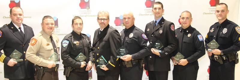 Eight first responders pose for a picture