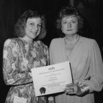 Charlotte Weiss accepts 1990 Best Student Paper Award from Toni Carbo Bearman (president)