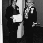 Barbara Laurence receiving SIG-of-the-Year Award from Joe Ann Clifton