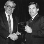 George E. Brown receiving award from Tom Hogan